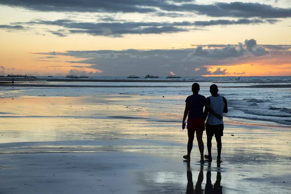 A gay love couple in the beach with the sunset in the valentine day