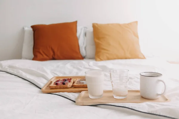 Breakfast set of breads and jam with milk and coffee on white bed. — Stock Photo, Image