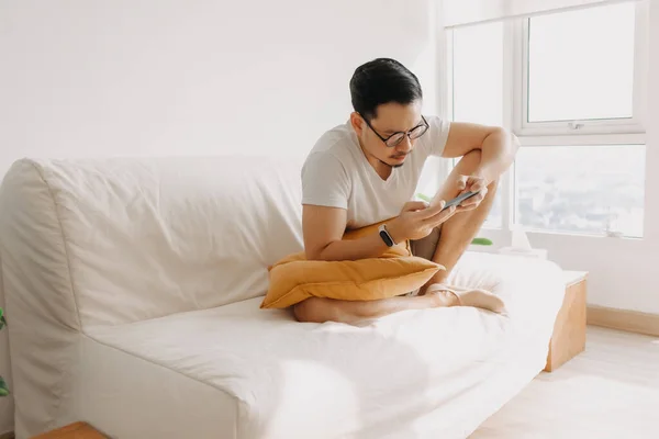 Sad man has bad online chat news and feels disappointed on the smartphone.  Stock Photo by ©sevendeman 506404148