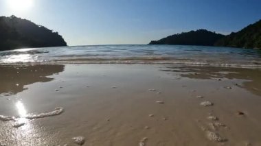 Wave and beach in Mu Ko Surin national park, Phang-Nga, Thailand.