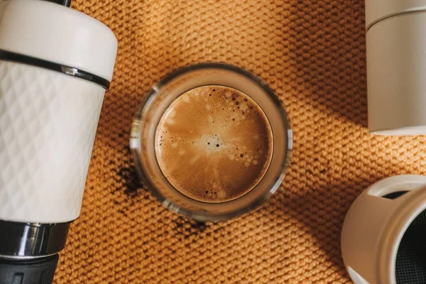 Above view of french press coffee with marble crema.