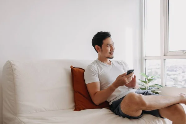 Happy Asian Man Using Smartphone His Living Room Casual Day — Stok Foto