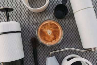 Espresso french press with coffee grinder equipments on grey background.