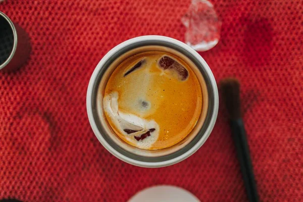 Americano coffee with grinder and handmade equipments on red cloth.