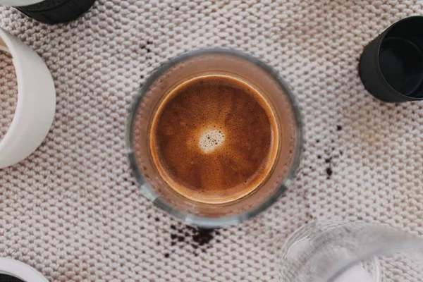 Above view of french press coffee with marble crema.