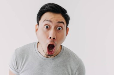 Funny shocked surprised closeup asian face man isolated on white background.