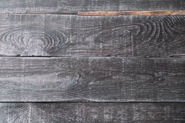 Boyanmamış tahtaların koyu arkaplanı. Ahşap doku.