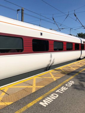 Northallerton, North Yorkshire, England, United Kingdom - August 11, 2022: A LNER Azuma train travelling through Northallerton train station in summer