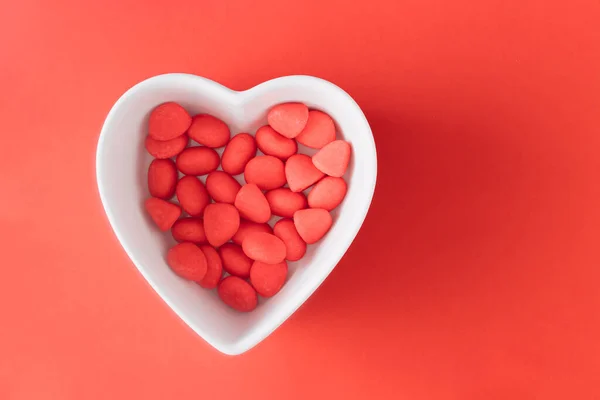 Red Candies White Heart Shaped Bowl Red Background Minimal Valentine — Stock Photo, Image