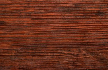 Dark brown natural textured wooden background.