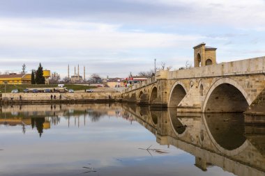 EDIRNE, TURKEY, DECEMBER 22, 2021:Tunca bridge over Tunca river and Selimiye Mosque inEdirne