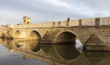 EDIRNE, TURKEY, DECEMBER 22, 2021:Tunca bridge over Tunca river and Selimiye Mosque inEdirne