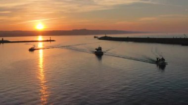 sunset istanbul province Sile district fishermen return to the harbor