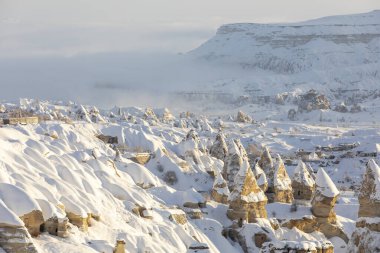 Pigeon Valley and Cave town in Goreme during winter time. Cappadocia, Turkey. 