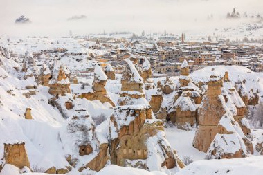 Pigeon Valley and Cave town in Goreme during winter time. Cappadocia, Turkey. 