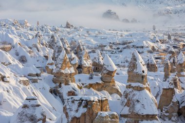 Pigeon Valley and Cave town in Goreme during winter time. Cappadocia, Turkey. 