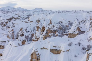 Pigeon Valley and Cave town in Goreme during winter time. Cappadocia, Turkey. 