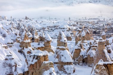 Pigeon Valley and Cave town in Goreme during winter time. Cappadocia, Turkey. 