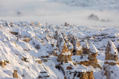 Pigeon Valley and Cave town in Goreme during winter time. Cappadocia, Turkey. 