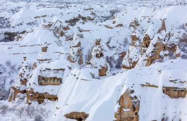 Pigeon Valley and Cave town in Goreme during winter time. Cappadocia, Turkey. 