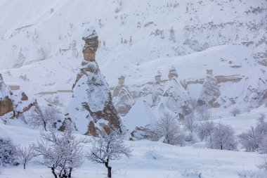 Pigeon Valley and Cave town in Goreme during winter time. Cappadocia, Turkey. 
