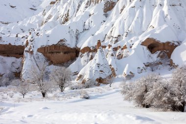 Pigeon Valley and Cave town in Goreme during winter time. Cappadocia, Turkey. 