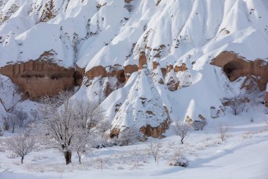 Pigeon Valley and Cave town in Goreme during winter time. Cappadocia, Turkey. 