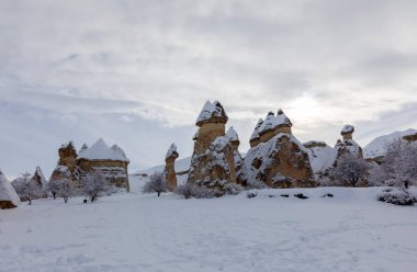 Pigeon Valley and Cave town in Goreme during winter time. Cappadocia, Turkey. 