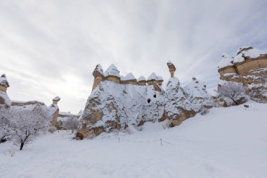 Pigeon Valley and Cave town in Goreme during winter time. Cappadocia, Turkey. 