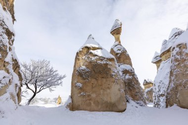 Pigeon Valley and Cave town in Goreme during winter time. Cappadocia, Turkey. 