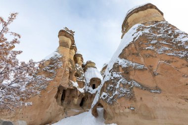 Pigeon Valley and Cave town in Goreme during winter time. Cappadocia, Turkey. 