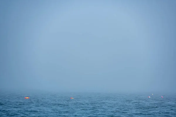 Lobster trap buoy floating on a choppy ocean in the Atlantic Ocean — Stock Photo, Image