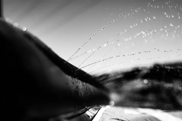 Selective focus on jets of droplets shooting out across a water slide — Foto de Stock