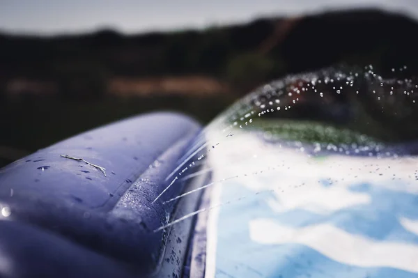 Selective focus on jets of droplets shooting out across a water slide — Foto de Stock