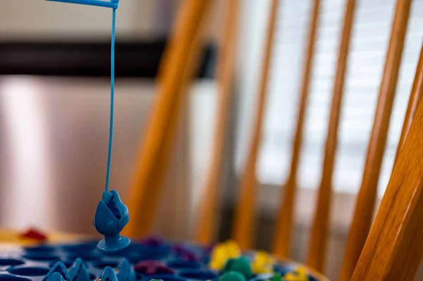 Childrens Game Using Miniature Pole Line Lowered Open Plastic Fish — ストック写真