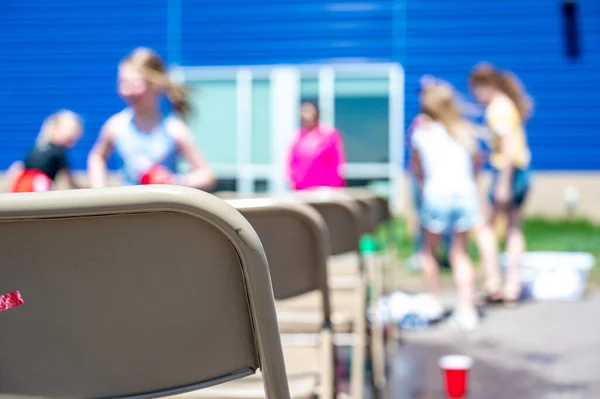 Selective Focus Rows Metal Folding Chairs Outdoor School Function Blurred — Stock Fotó