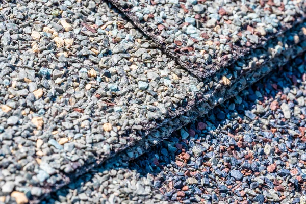 Macro of asphalt shingle layered seam. High quality photo