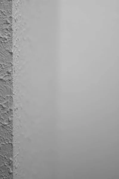 Corner section of drywall with a Stomp brush style texture from the 1980s.. High quality photo