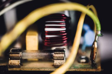 Brown damaged fuse that has blown and defective. High quality photo