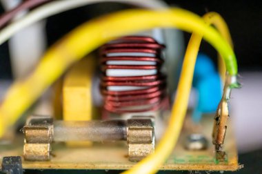 Brown damaged fuse that has blown and defective. High quality photo