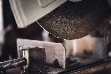 Selective focus on chop saw abrasive blade used for cutting metal. High quality photo