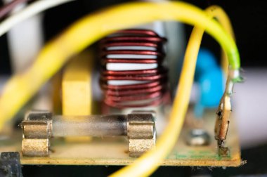 Brown damaged fuse that has blown and defective. High quality photo