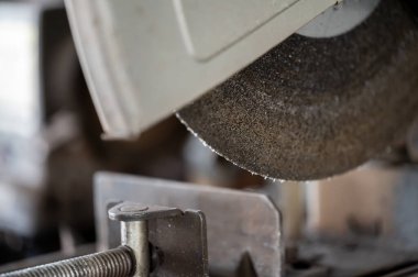 Selective focus on chop saw abrasive blade used for cutting metal. High quality photo