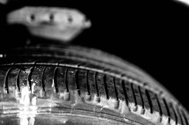 screw protruding from the tread of a tire causing a flat. High quality photo