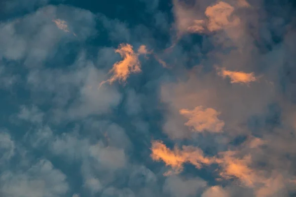 Colorful clouds in the sky at sunset directly above view