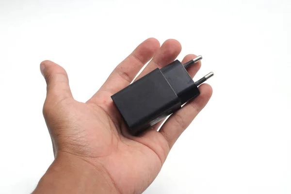 Черный Мобильный Телефон Зарядное Устройство Адаптер Руку Изолированы Белом Фоне — стоковое фото
