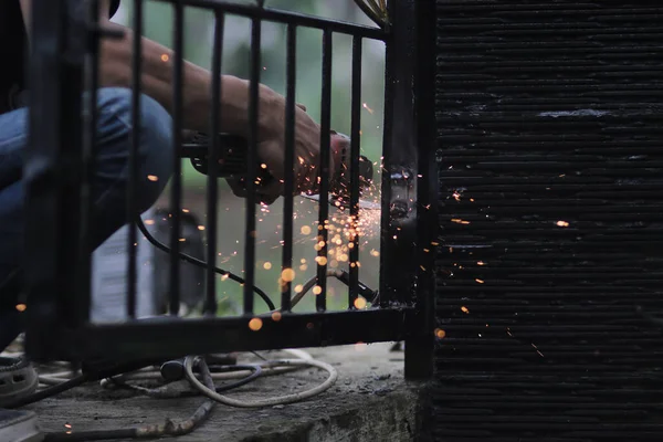 Man Repairs Fence Welding Metal Electric Welding Machine Profession Welder — Stock Photo, Image
