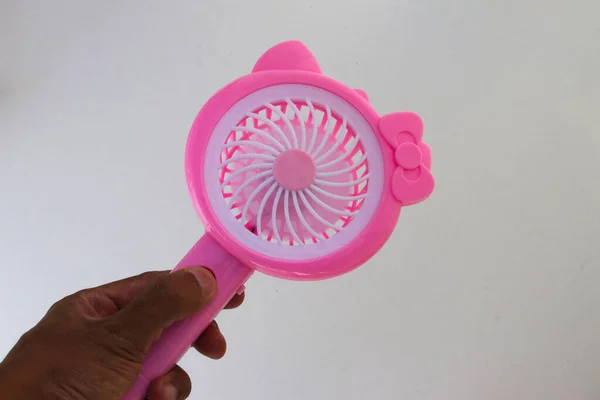 Asian Man Hand Holding Pink Handy Mini Fan Isolated White — Stock Photo, Image