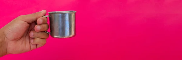 Hand Holding Small Stainless Steel Cup Copy Space Isolated Magenta — ストック写真