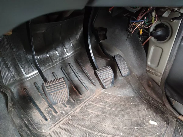 BraClose-up view of brake and gas pedal on an old car interior